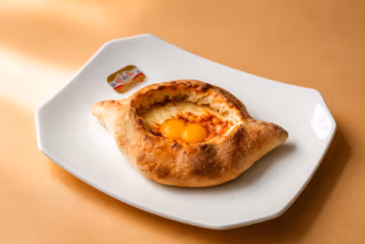 Mini Adjarian khachapuri with quail eggs