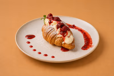 Croissant dessert with cherry sauce